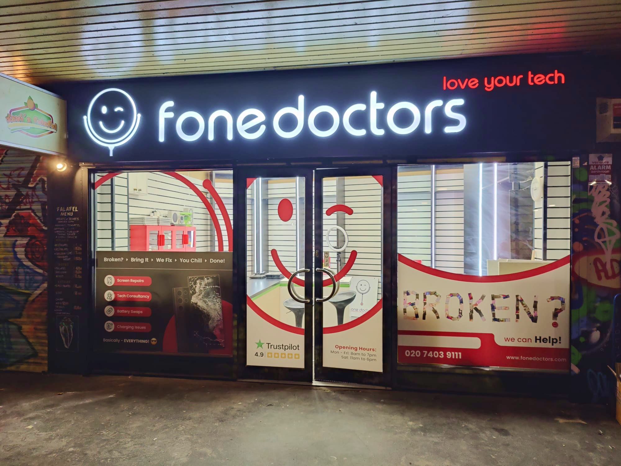 fone doctors London Bridge clinic storefront at night